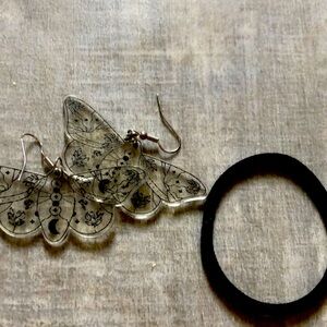 Moth earrings. Hair tie for scale. Worn once, perfect condition